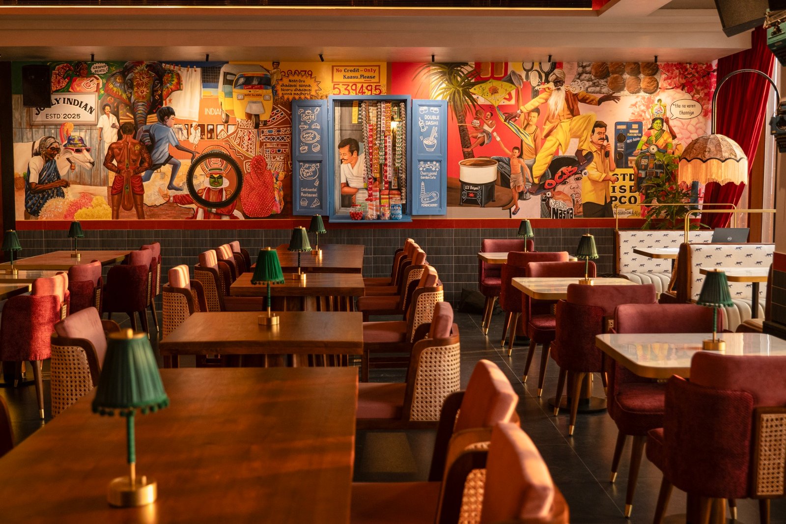 Interior décor at Jolly Indian, Alwarpet — retro pan-Indian art and petti kadai walls